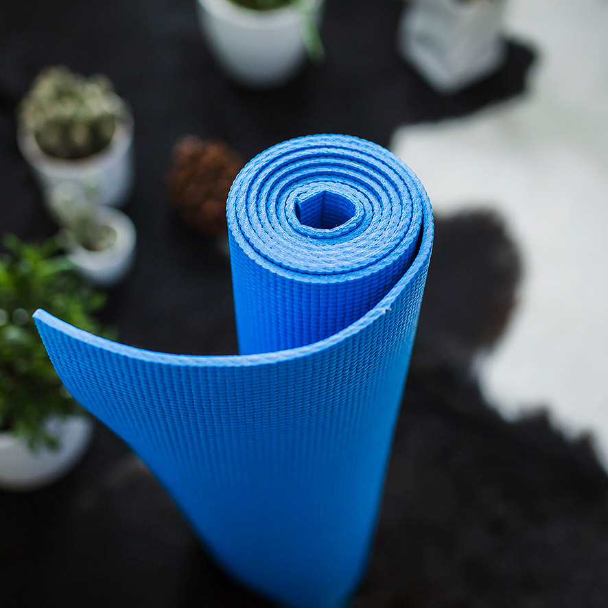 rolled-up-yoga-mat-floor